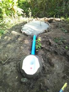 A pipe was connected from the toilet bowl to compost hole 